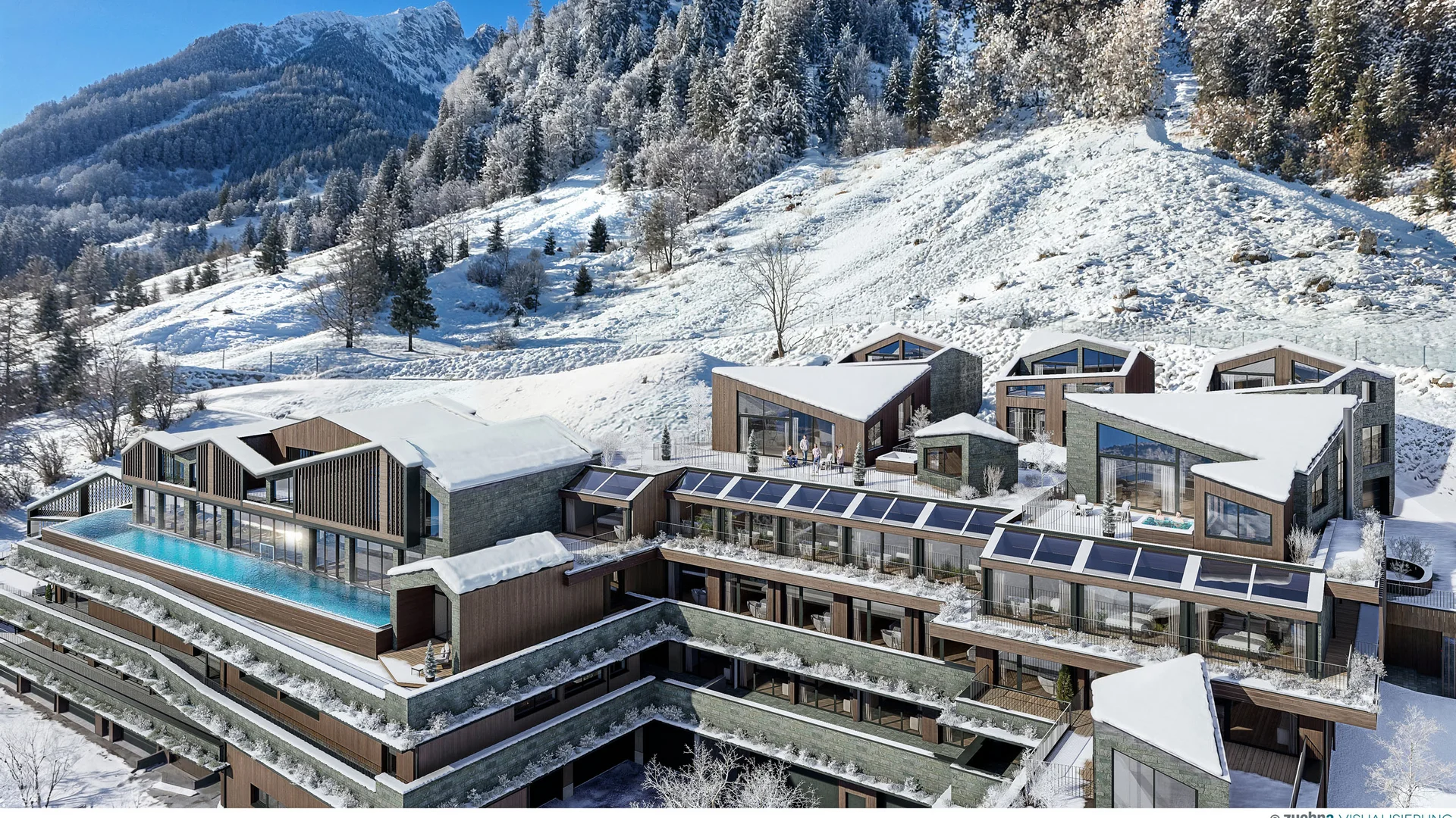 Modernes Resort mit Pool in verschneiter Berglandschaft